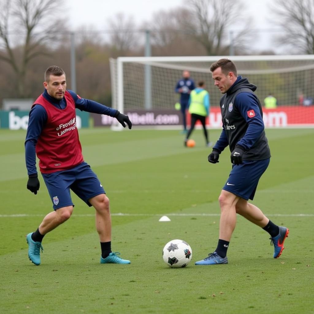 Haaland and Trent training together, practicing passing drills.