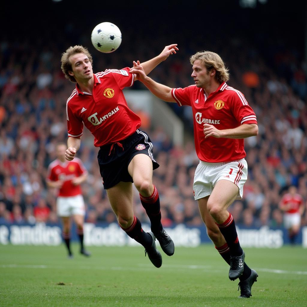 Haaland contests an aerial ball against a Manchester United defender