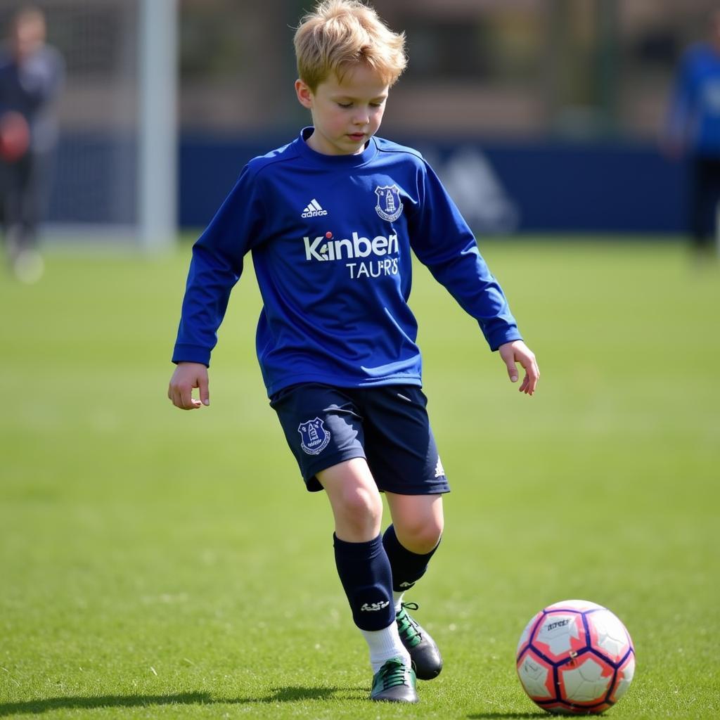 Kieran Dowell during his time in the Everton youth academy, displaying his skill and promise.