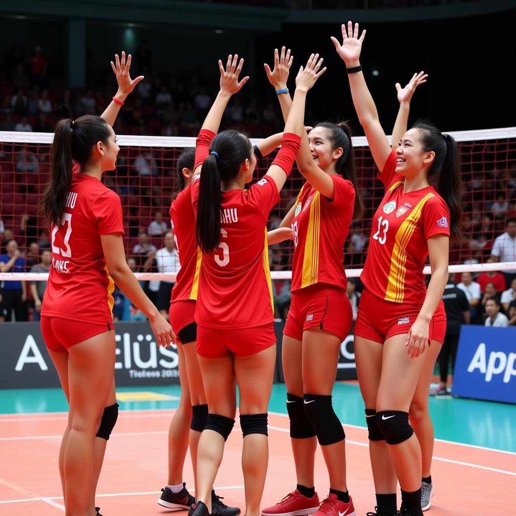 Nguyen Thi Hoa celebrating with her teammates after a successful play.