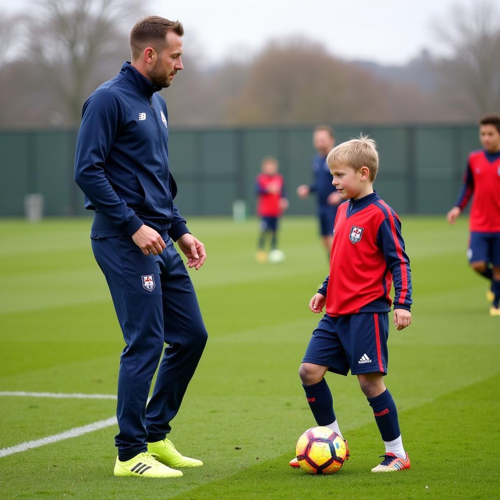 Young Footballer Receiving Coaching in 2015