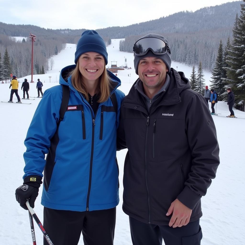 Erling Haaland poses with a ski instructor at a ski resort.