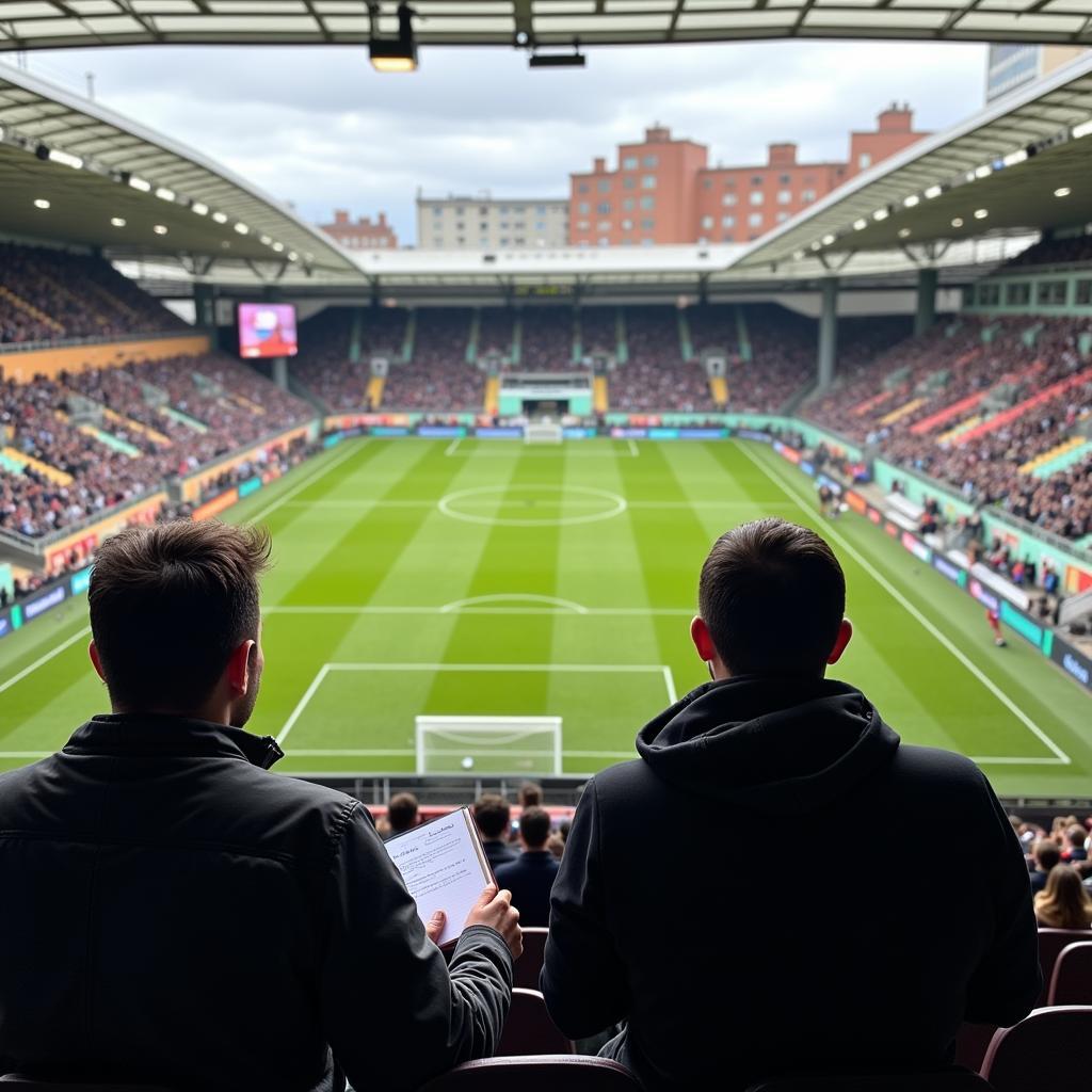 A football scout observing a youth game