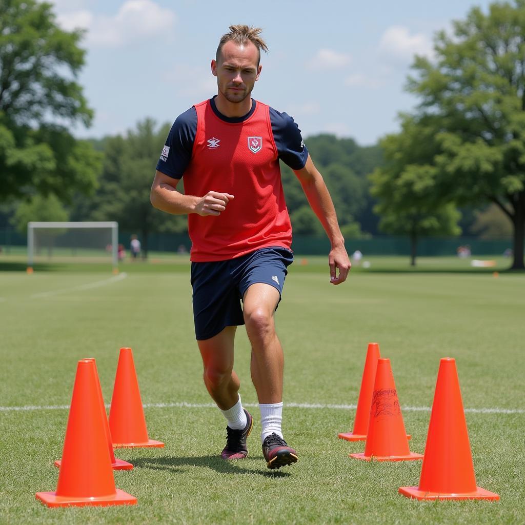 Erling Haaland practicing agility drills on the training field.