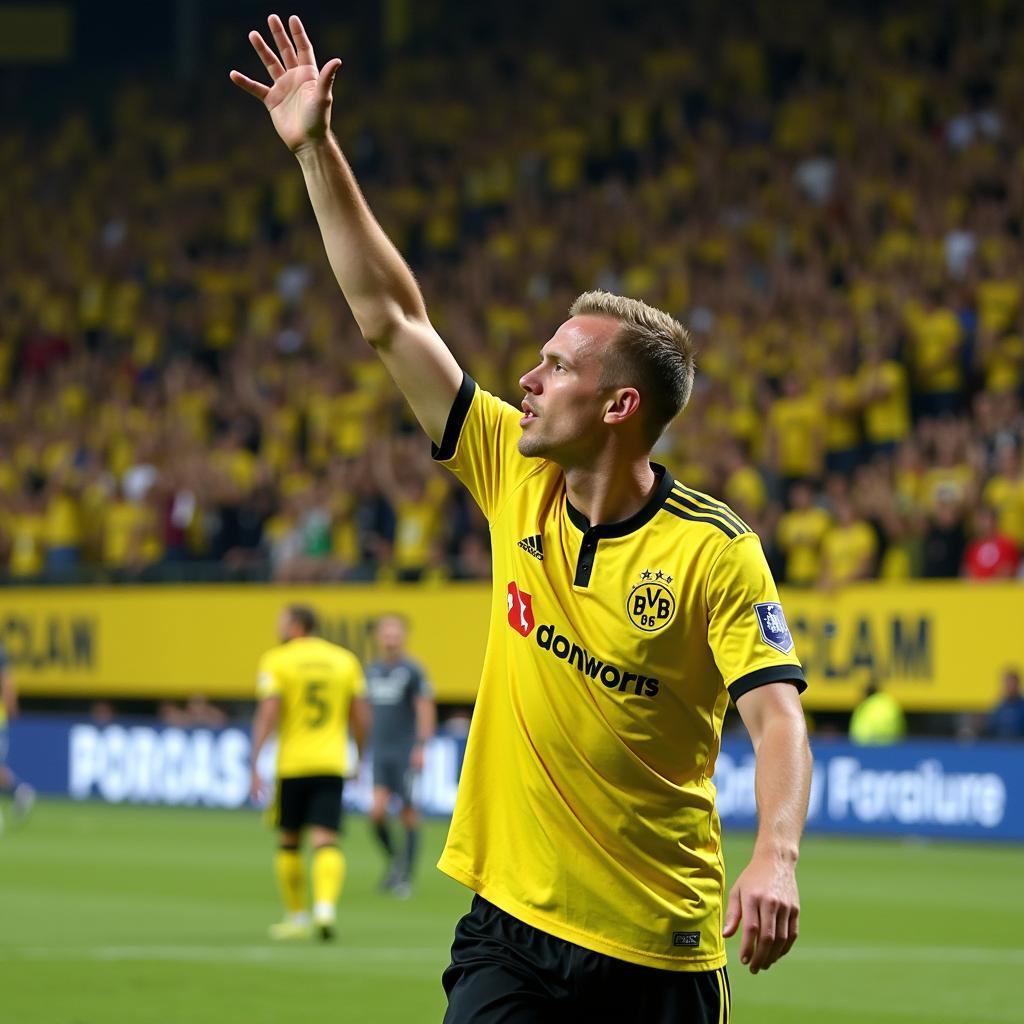 Haaland acknowledging the Dortmund fans in the Yellow Wall