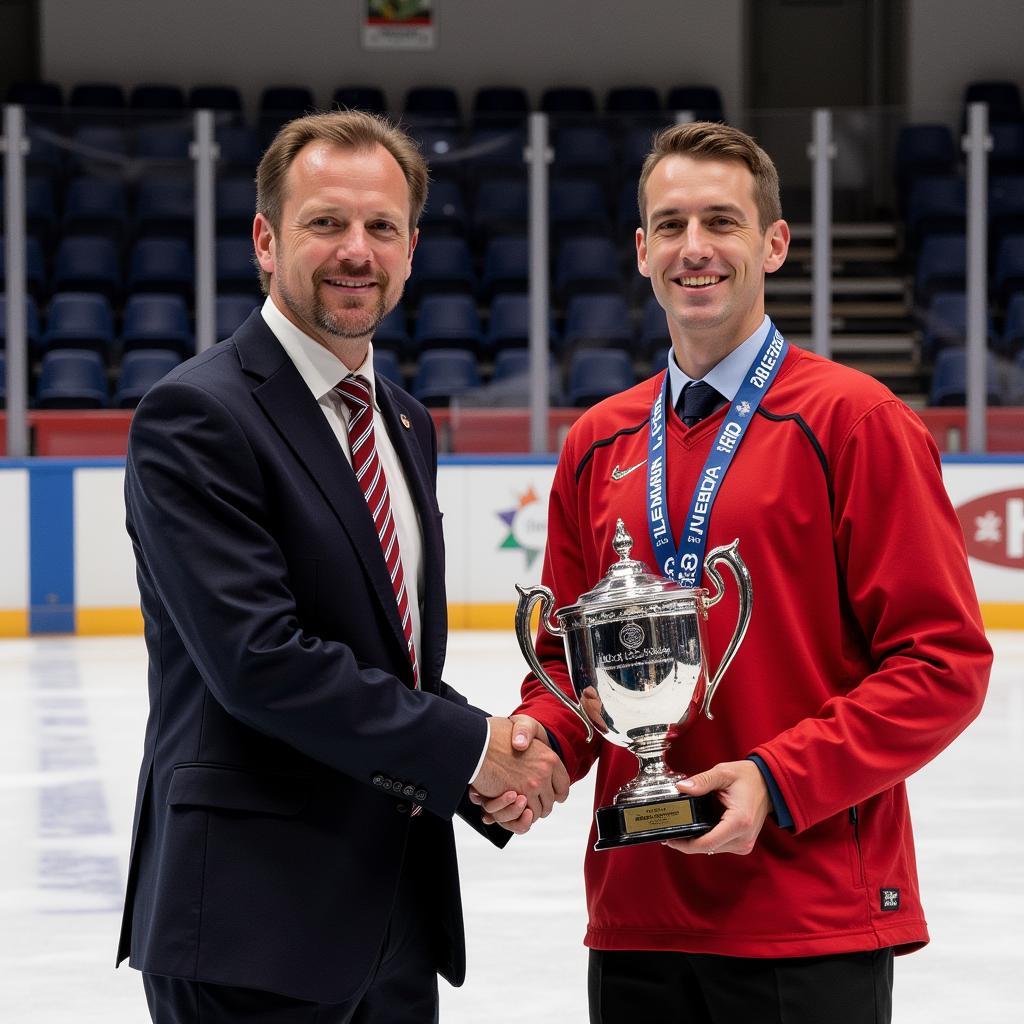 Erling Haaland smiles as he receives a golden boot award, recognizing his achievements as a top goalscorer. He is dressed in a formal suit and holding the trophy proudly.