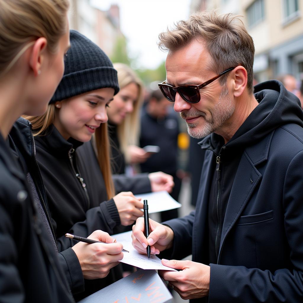 Erling Haaland signing autographs wearing sunglasses