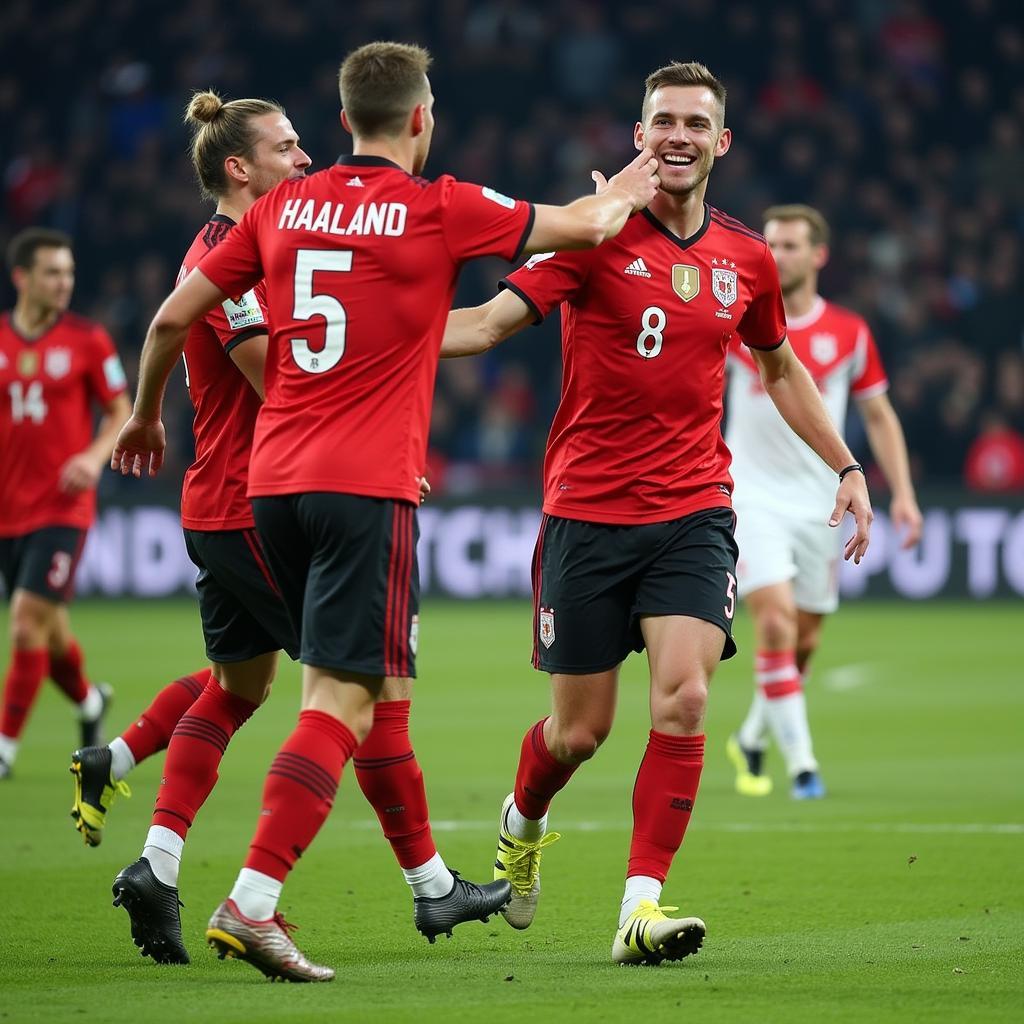 Haaland celebrates a goal with his teammates