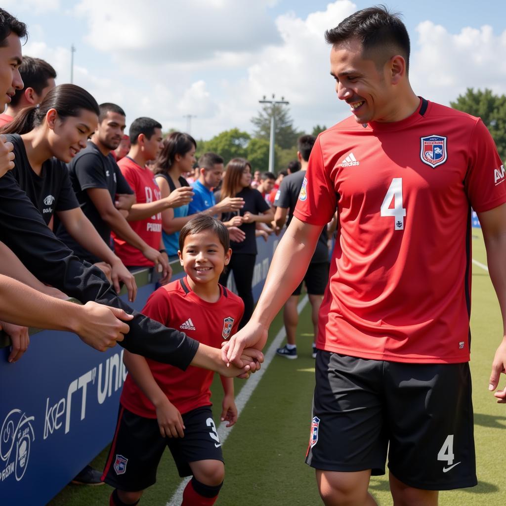 Hanoi FC's Number 4 interacts with fans, highlighting their connection with the supporters and their role as a representative of the club.