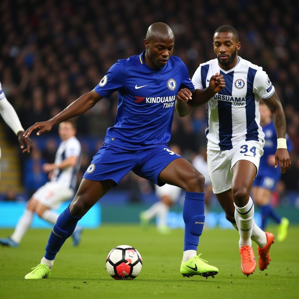 N'Golo Kante winning a tackle in Chelsea jersey during 2016-2017 Premier League Season