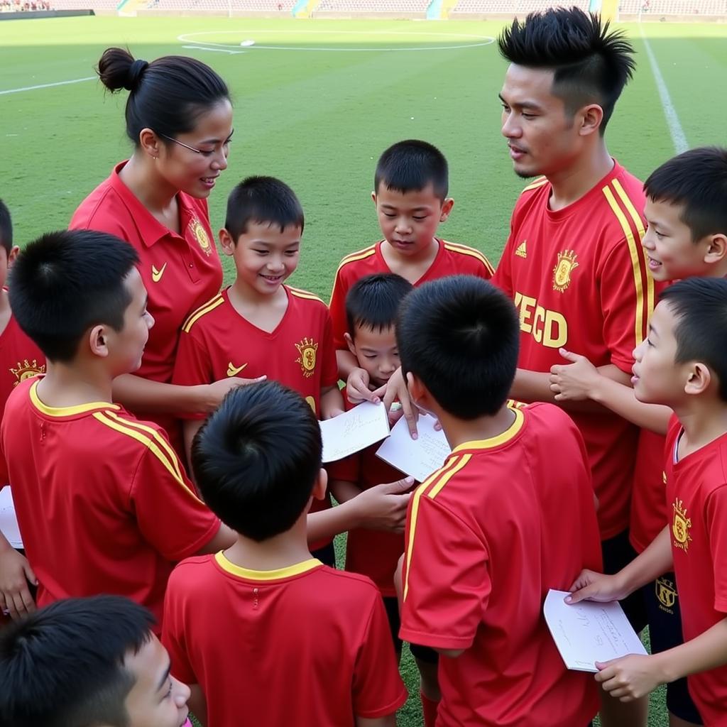 Nguyen Trong Hoang interacting with young fans, inspiring the next generation of Vietnamese footballers.