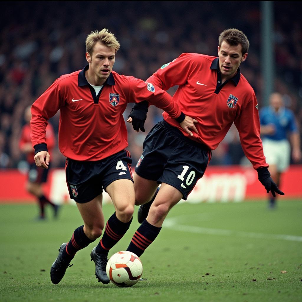 Roy Keane and Alf-Inge Haaland clash during a Manchester derby